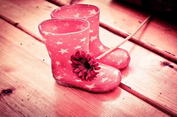 Girl's striped wellingtons — Stock Photo, Image