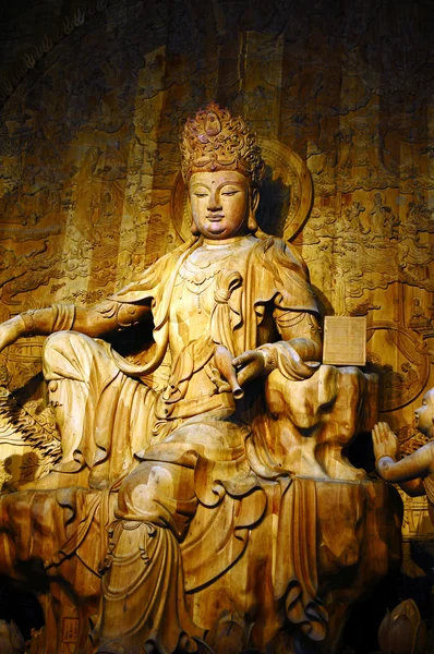 Trä-carving buddha Stockfoto