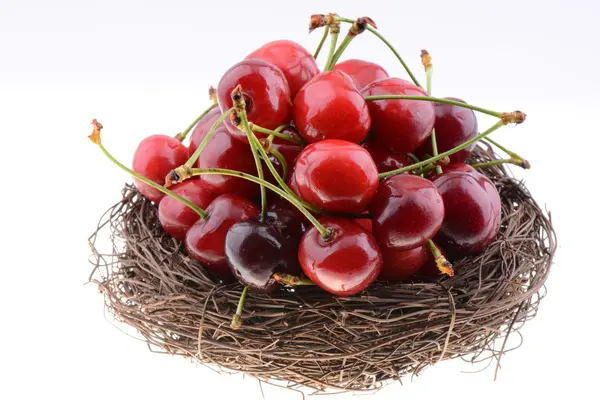 Sweet cherries in a nest — Stock Photo, Image