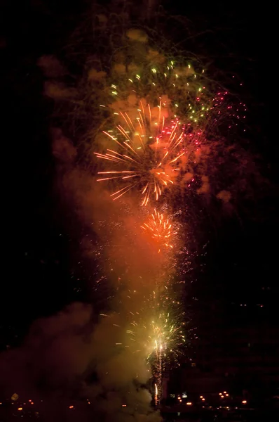 Fireworks over water — Stock Photo, Image