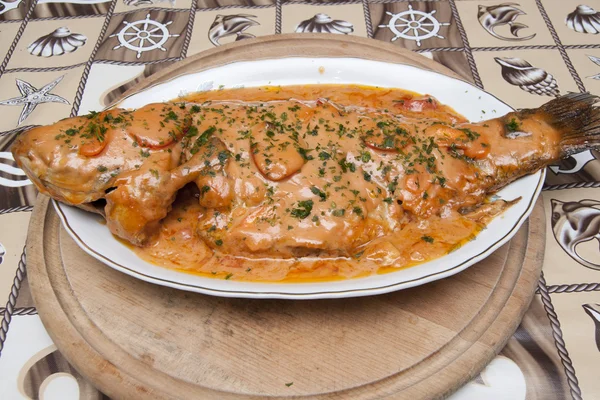 Carp with garlic sauce — Stock Photo, Image