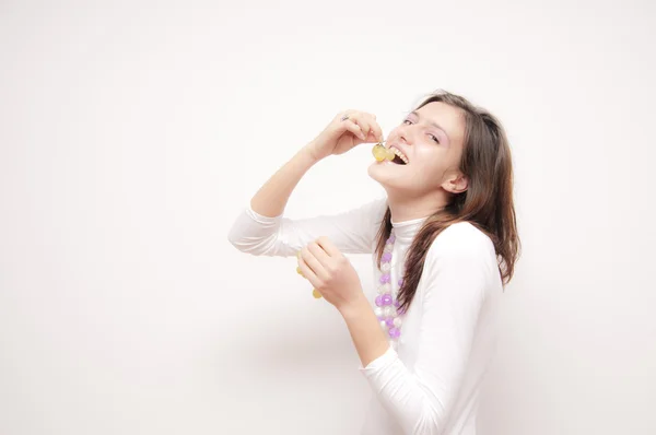 Young Woman eating grapes Stock Image