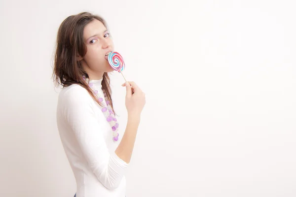 Chica con un caramelo —  Fotos de Stock