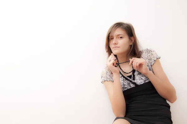 Young woman in black dress — Stock Photo, Image