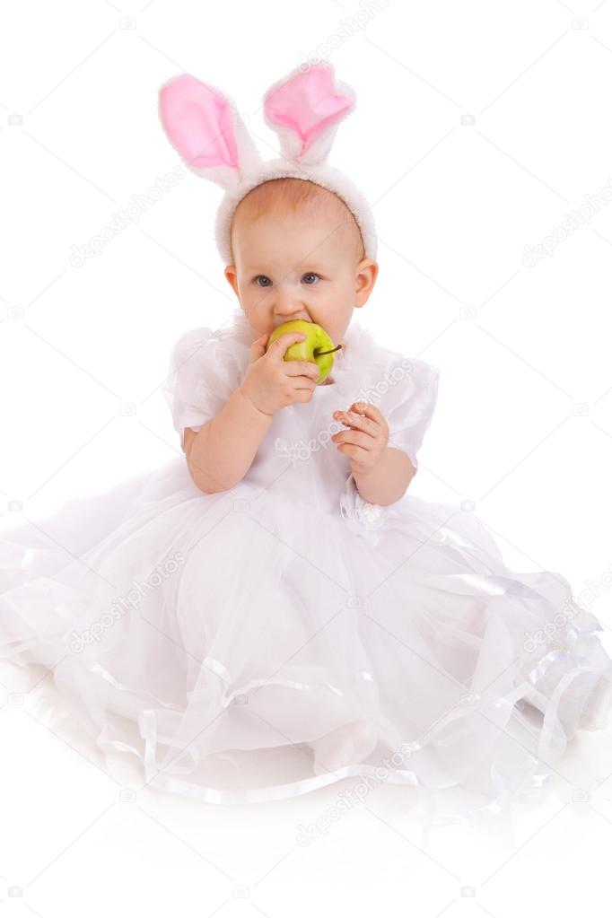 Portrait of little girl eating apple