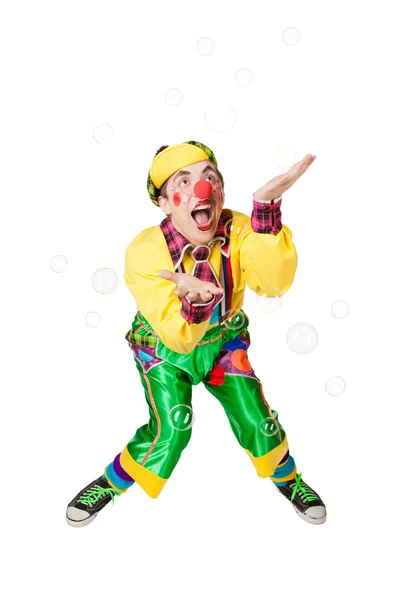 Cheerful clown in the soap bubbles — Stock Photo, Image