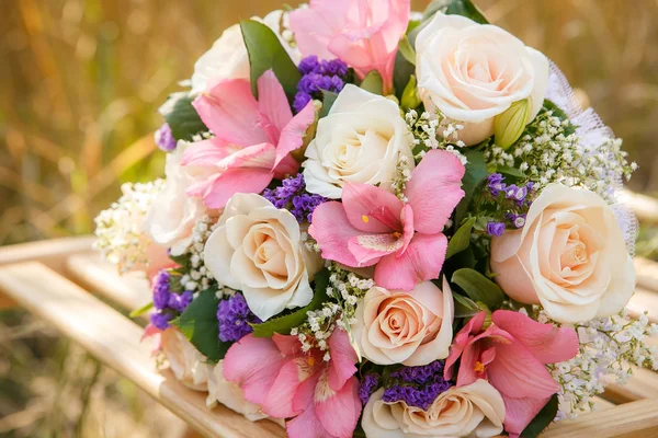 Bouquet of the bride on the chair — Stock Photo, Image