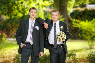 Portrait of the groom with the best man clipart