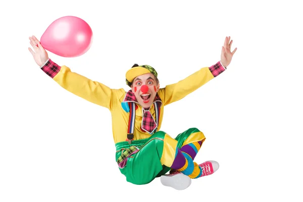 Клоун с воздушным шаром в руке — стоковое фото