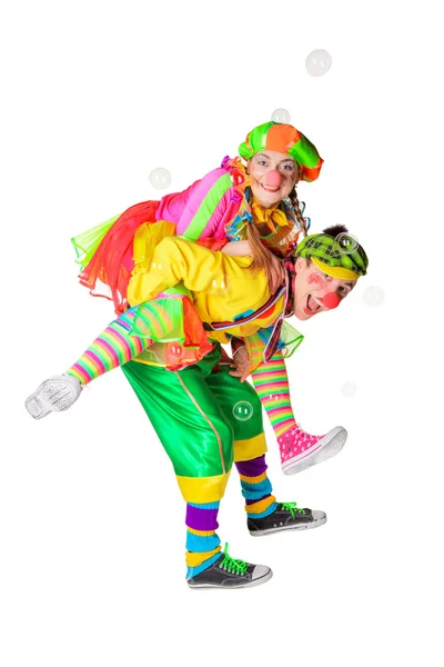 Two cheerful clowns in the soap bubbles — Stock Photo, Image