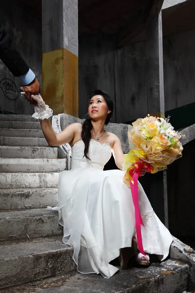 Bride Holding Groom's Hand at Old Grunge Place — Stock Photo, Image