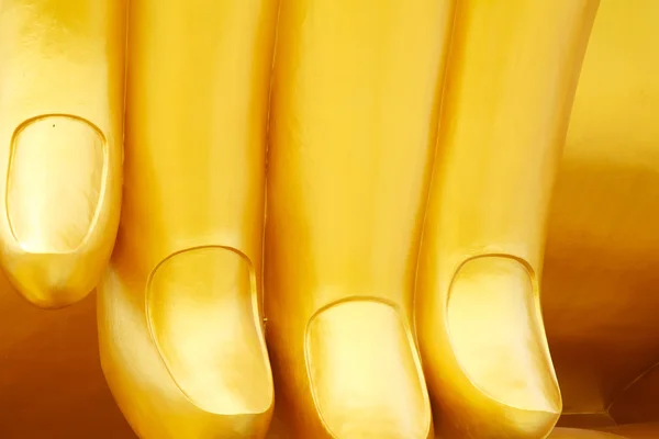 Golden finger of sitting Buddha — Stock Photo, Image