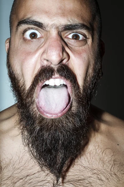 Man with beard with frightening expressions Stock Photo