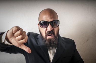 Man bouncer with sunglasses and negative expression clipart