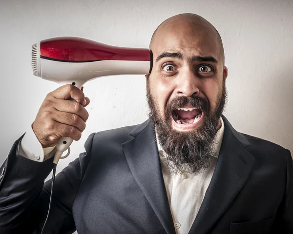 Uomo con un vestito e la barba e strane espressioni — Foto Stock