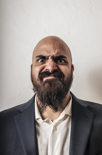 Elegant bearded man with jacket and funny expressions — Stock Photo, Image