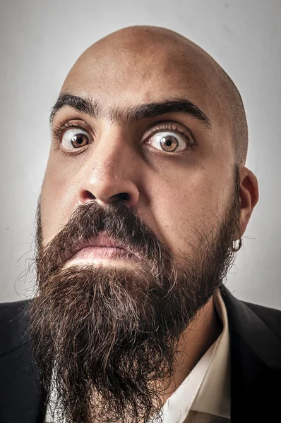 Hombre barbudo elegante con chaqueta y expresiones divertidas —  Fotos de Stock