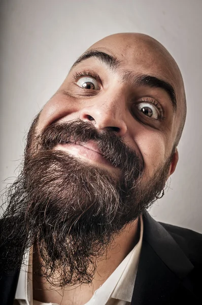 Hombre barbudo elegante con chaqueta y expresiones divertidas —  Fotos de Stock