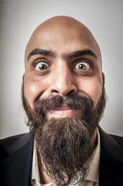 Ceket ve komik ifadeler ile zarif sakallı adam — Stok fotoğraf
