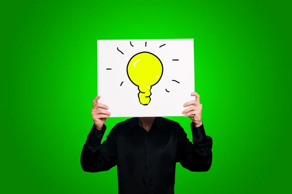 Bulb on green background — Stock Photo, Image