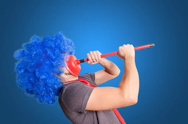 Funny guy holding red plunger in his face — Stock Photo, Image