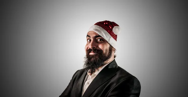 Modern şık Noel Baba uyguladıktan natale gülümseyen — Stok fotoğraf