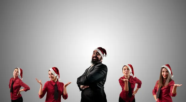 Business jultomten och hans jul assistent flickor — Stockfoto