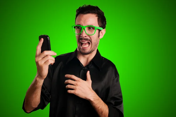 Scared man holding phone — Stock Photo, Image