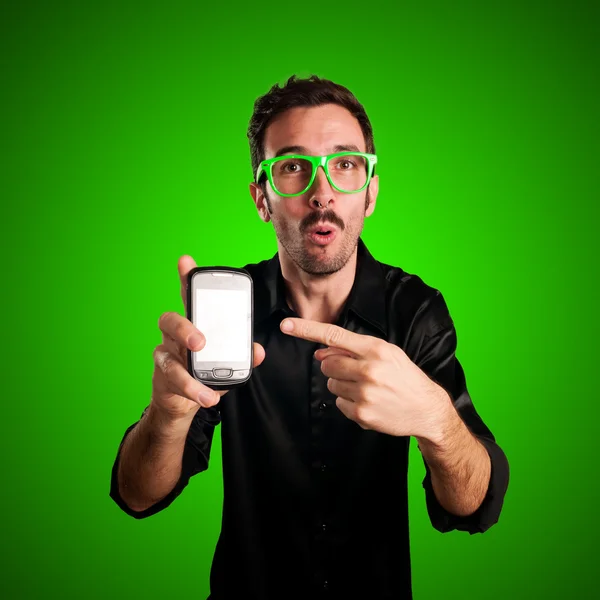 Homem engraçado segurando telefone — Fotografia de Stock