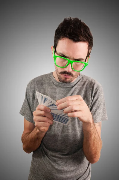 Guy holding poker cards — Stock Photo, Image