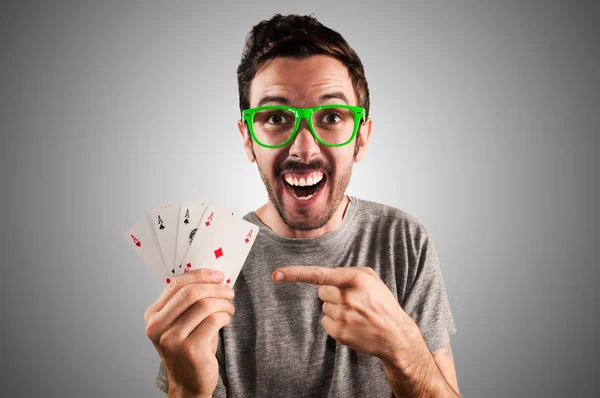 Winner guy holding poker cards — Stock Photo, Image