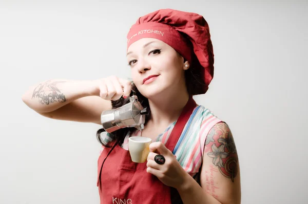 Beautiful tattooed pinup cook girl with coffeepot — Stock Photo, Image