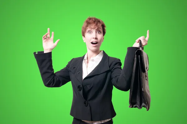 Mujer de negocios asombrada con maletín —  Fotos de Stock