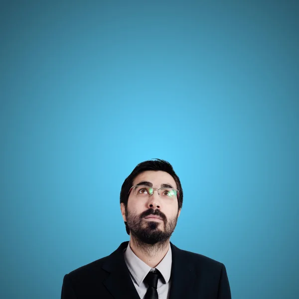 Bearded business man looking up — Stock Photo, Image