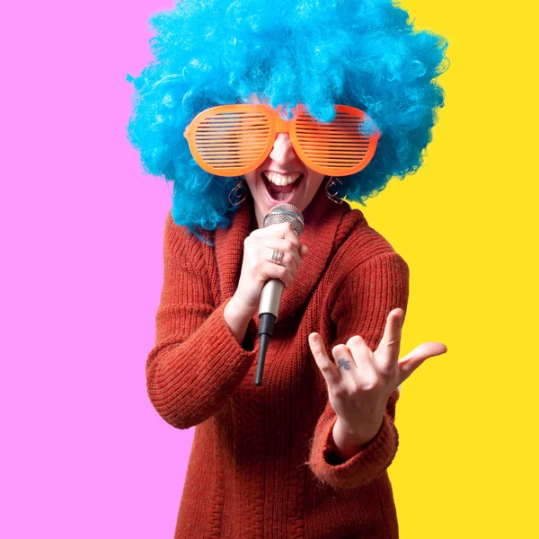 Beautiful girl with curly blue wig and turtleneck — Stock Photo, Image