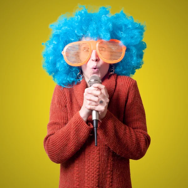 Beautiful girl with curly blue wig and turtleneck — Stock Photo, Image