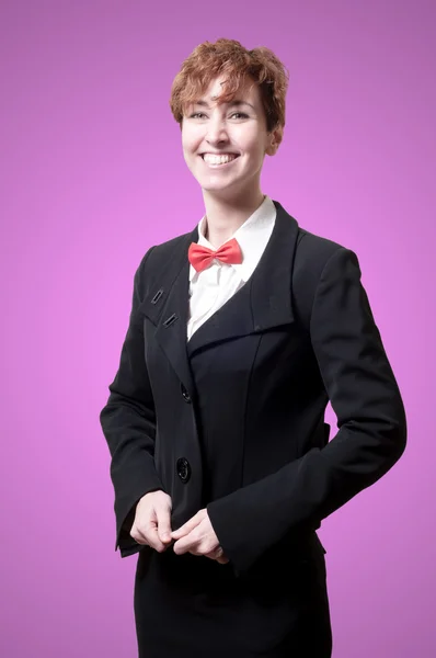 Smiling elegant businesswoman with bow tie — Stock Photo, Image