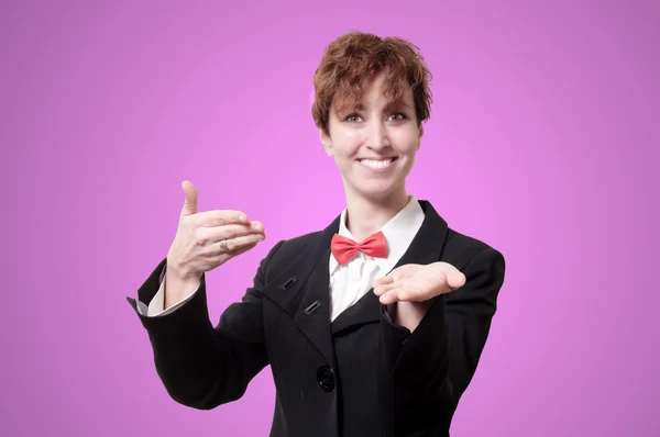 Elegant businesswoman with bow tie showing — Stock Photo, Image