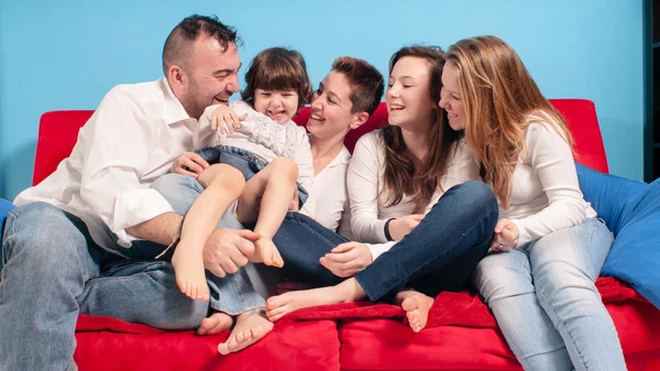 Happy family on the couch — Stock Photo, Image