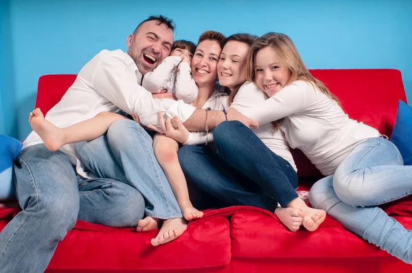 Happy family on the couch — Stock Photo, Image