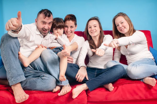 Happy family on the couch — Stock Photo, Image