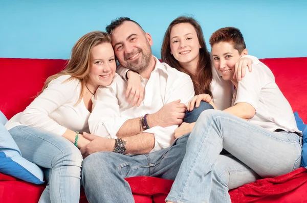 Happy family on the couch — Stock Photo, Image