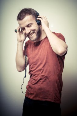 vintage portrait of fashion smiling guy with headphones clipart