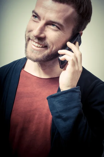 Vintage portrait of fashion guy on the phone — Stock Photo, Image