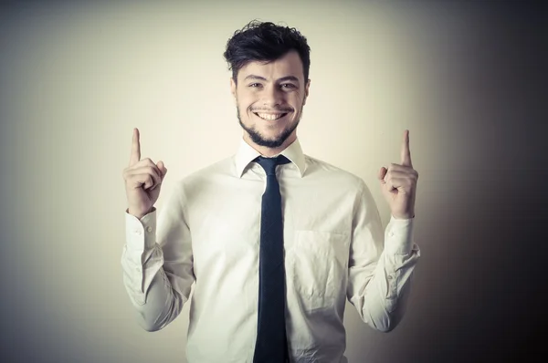 Elegante chico moderno con camisa blanca señalando —  Fotos de Stock