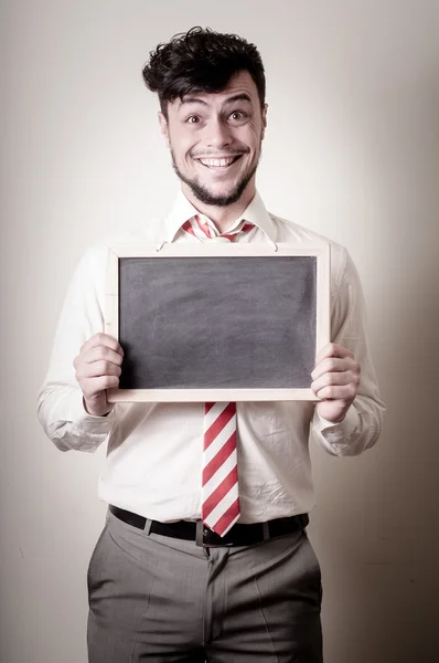 Hombre de negocios con una pizarra en blanco — Foto de Stock