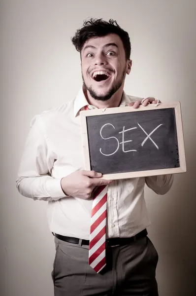 Businessman with a blank blackboard write sex — Stock Photo, Image