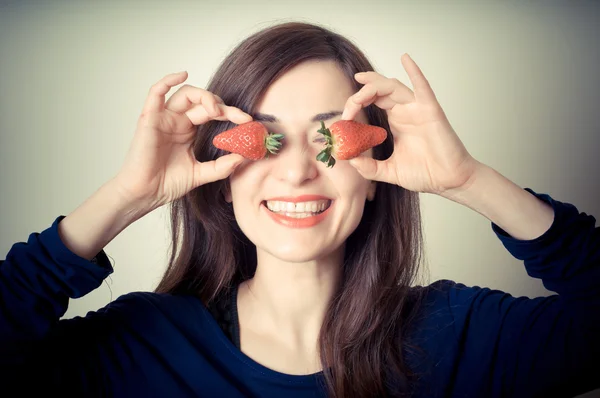 Beautiful woman with strawberries on eyes — Stock Photo, Image