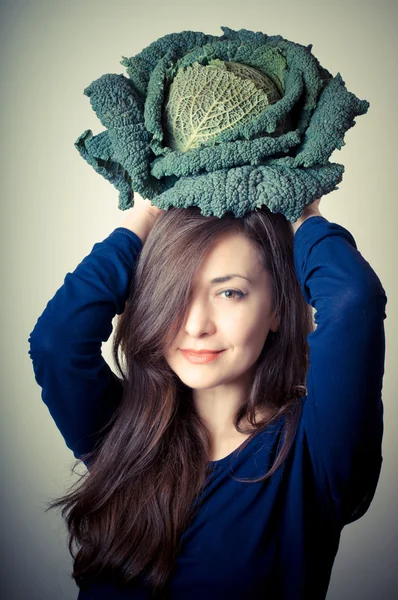 Beautiful woman with savoy cabbage — Stock Photo, Image