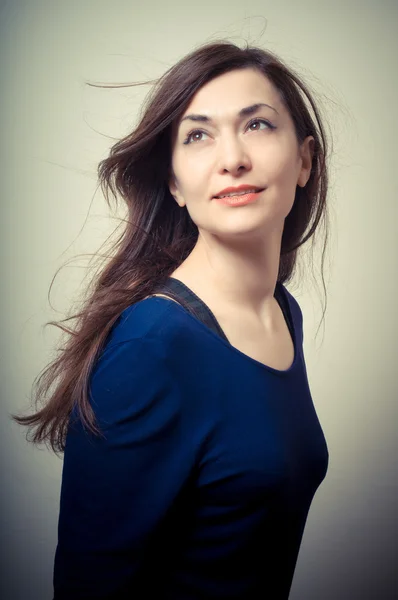 Portrait of beautiful girl with long hair and blue sweater — Stock Photo, Image